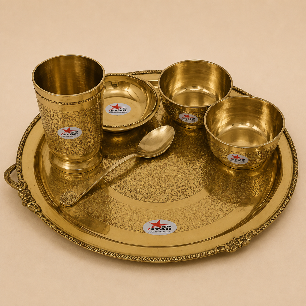 Nutristar 6 piece brass dinner set with large thali, three bowls, drinking glass, spoon.