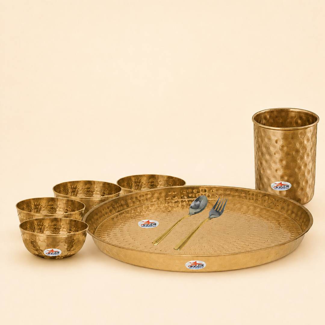 Nutristar 8 piece brass dinner set with large thali, four bowls, drinking glass, spoon and fork