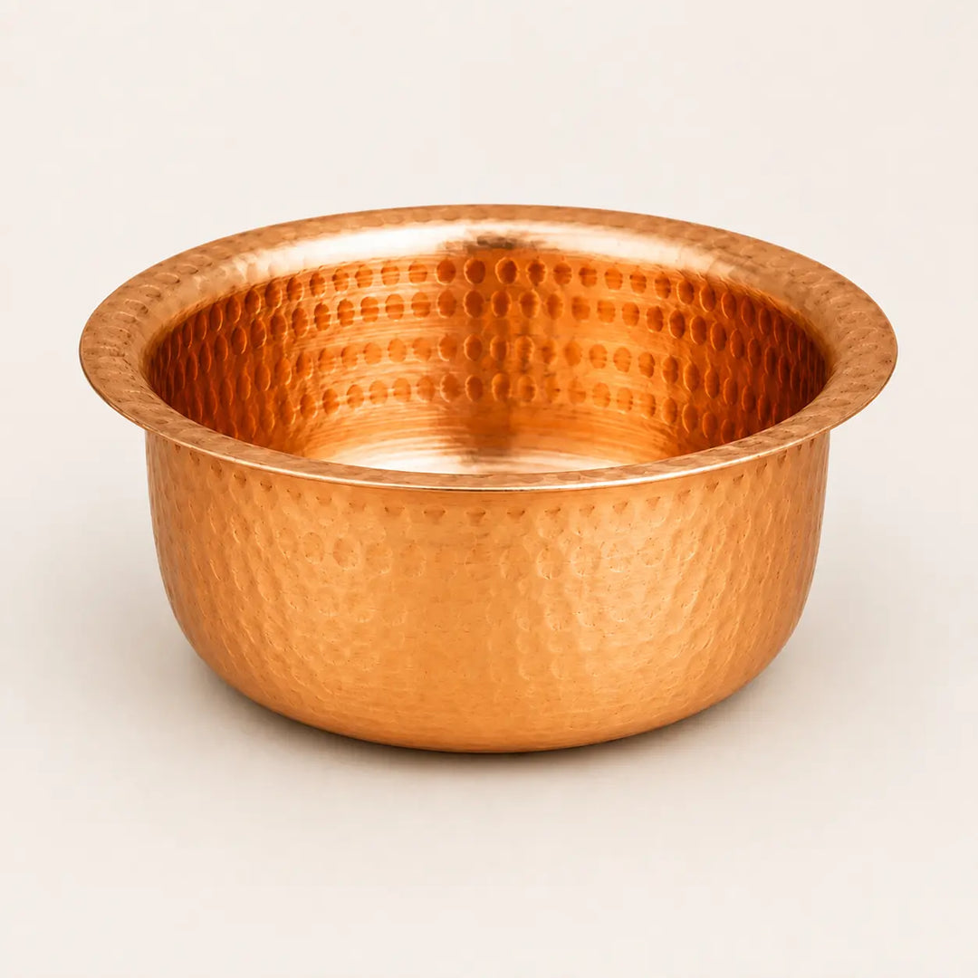 Nutristar hammered copper bowl with wide rim and traditional copper finish on off-white background