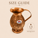 Embossed copper serving jug with floral design and comfortable handle