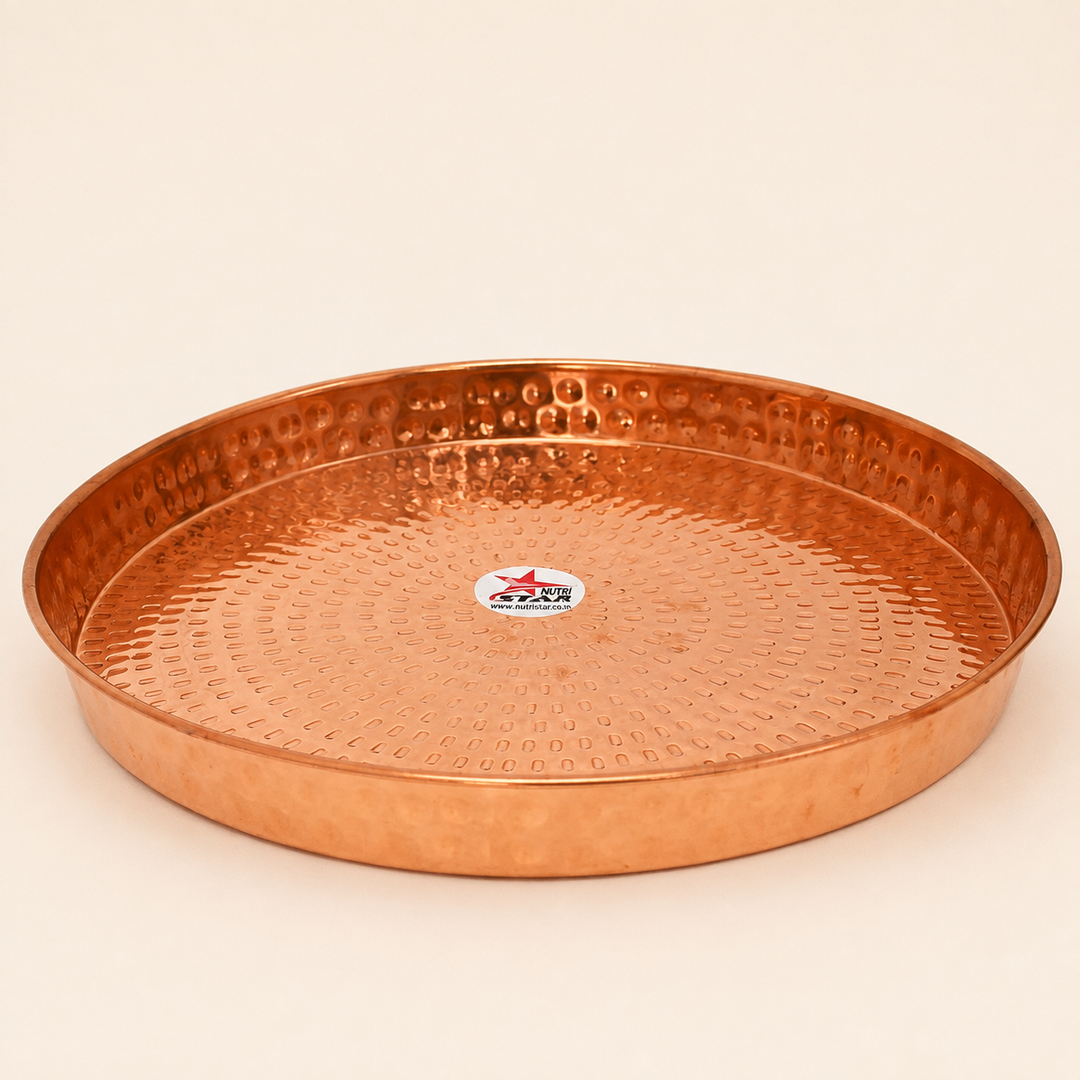 Copper serving plate with hammered texture raised rim and durable construction
