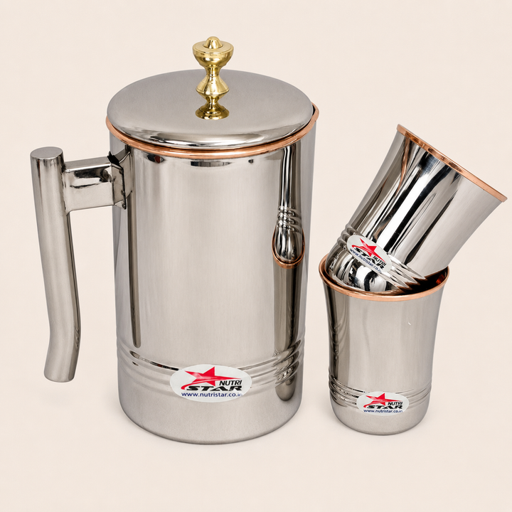 Nutristar stainless steel water jug with lid and two matching glasses with copper accents