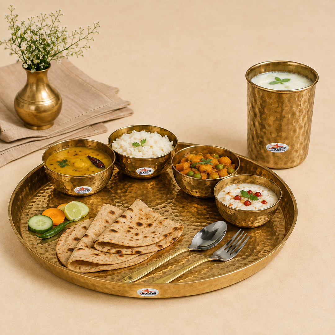 Nutristar 8 piece brass dinner set with large thali, four bowls, drinking glass, spoon and fork