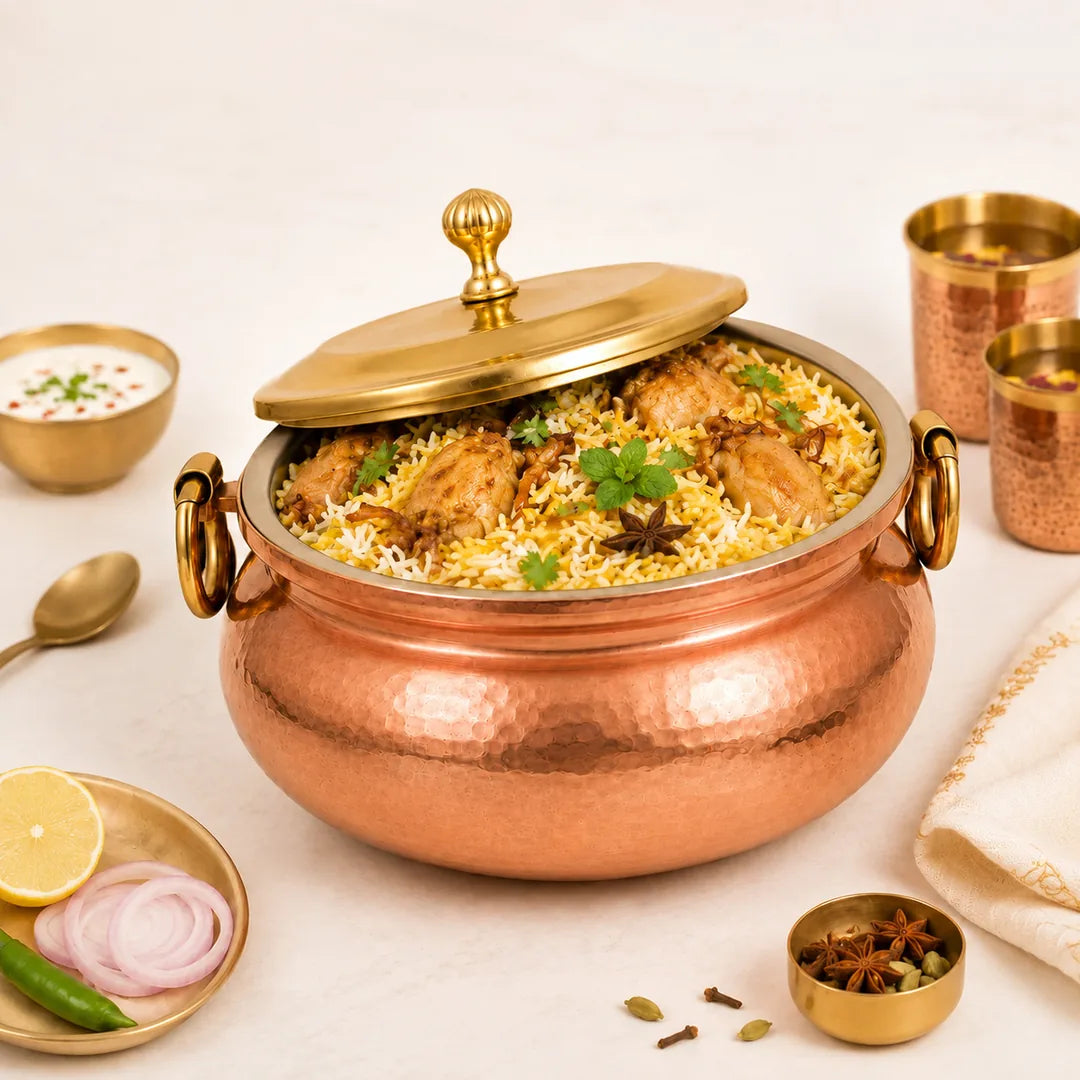 Nutristar hammered copper biryani handi filled with chicken biryani for traditional serving and festive dining
