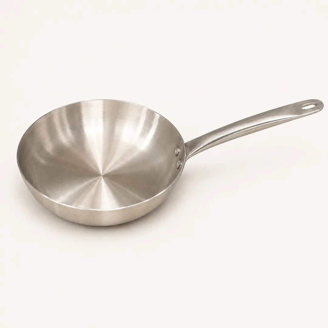 Nutristar stainless steel triply frypan with long sturdy handle on off-white background