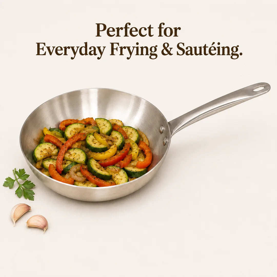Nutristar stainless steel triply frypan with sautéed vegetables for everyday frying and cooking