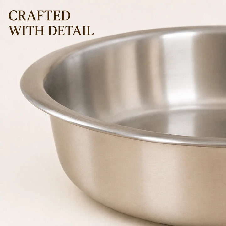 Close-up of Nutristar triply stainless steel shallow pot showing wide rolled rim and brushed steel finish
