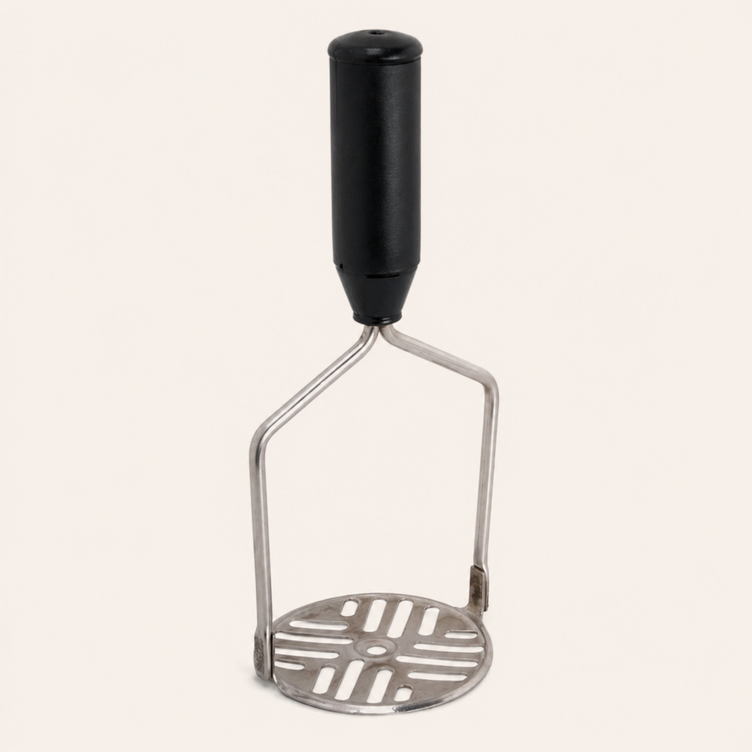 Nutristar stainless steel potato masher with black comfort grip handle and slotted mashing plate