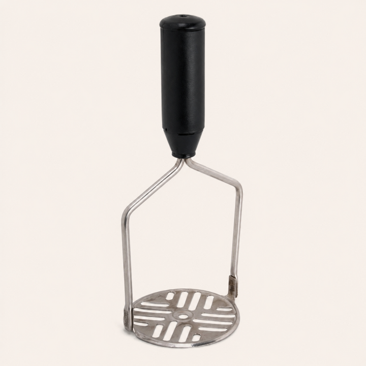 Nutristar stainless steel potato masher with black comfort grip handle and slotted mashing plate